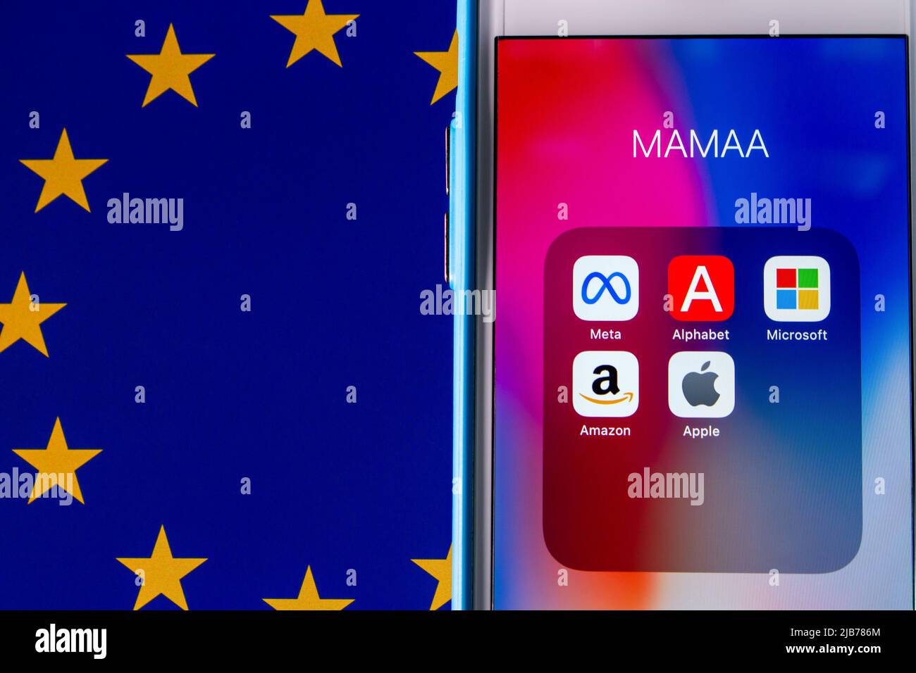 Kumamoto, JAPAN - May 11 2022 : MAMAA (GAFA Big Tech, Meta Platform Inc., Alphabet Inc., Microsoft, Amazon and Apple) on an iPhone on an Eu Flag bg. Stock Photo