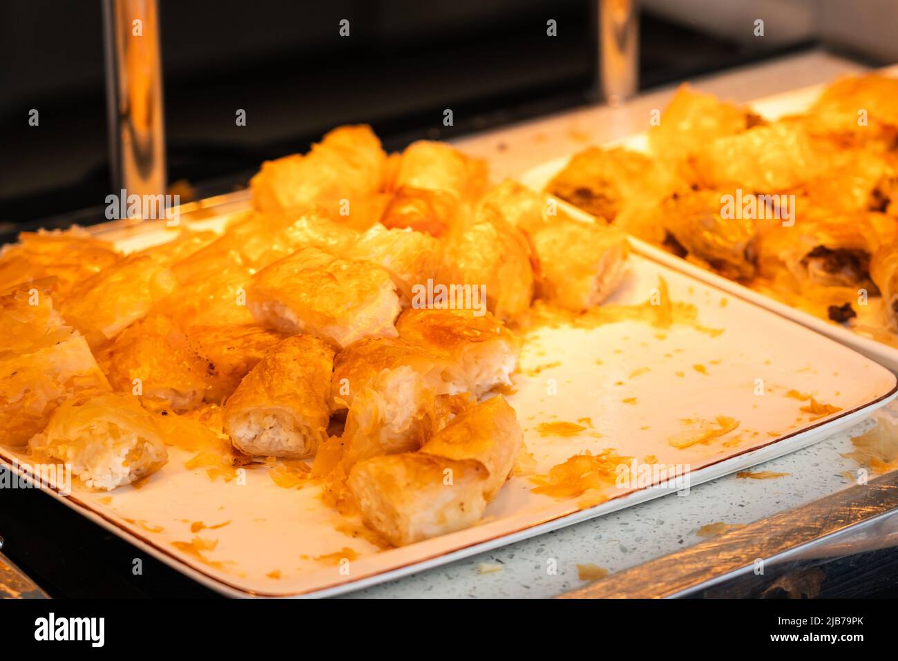 Rolls of puff pastry with cheese in hotel buffet Stock Photo Alamy
