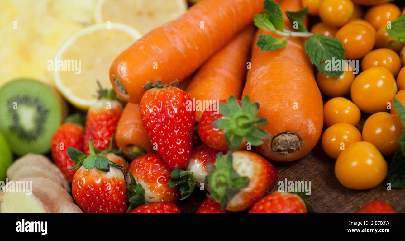 Image of fresh organic vegan food with fruit and vegetables on wooden ...