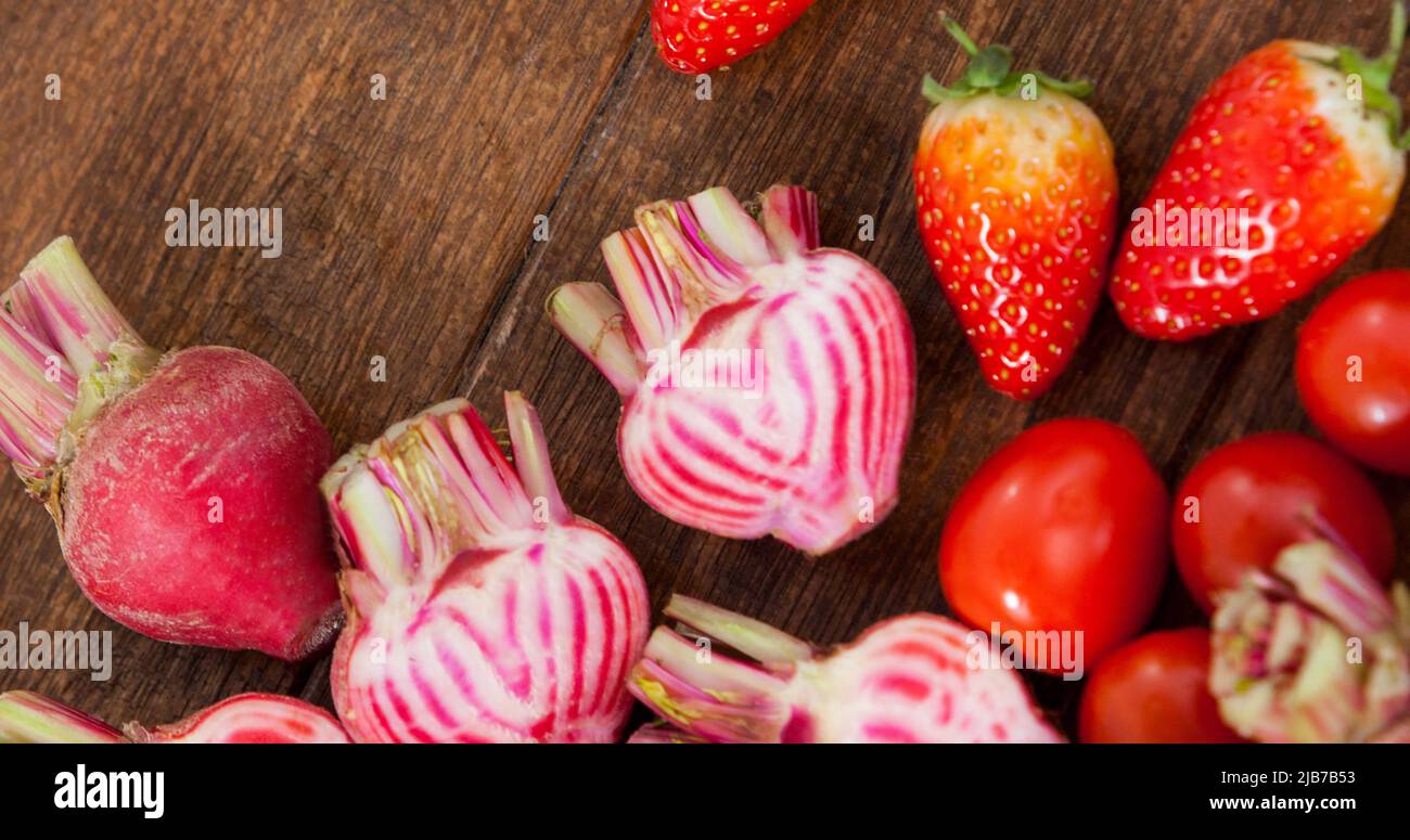 Image of fresh organic vegan food with strawberries and vegetables on ...