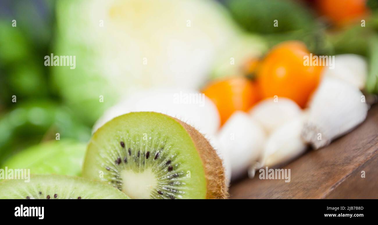 Image of fresh organic vegan food with kiwi fruit and vegetables on ...