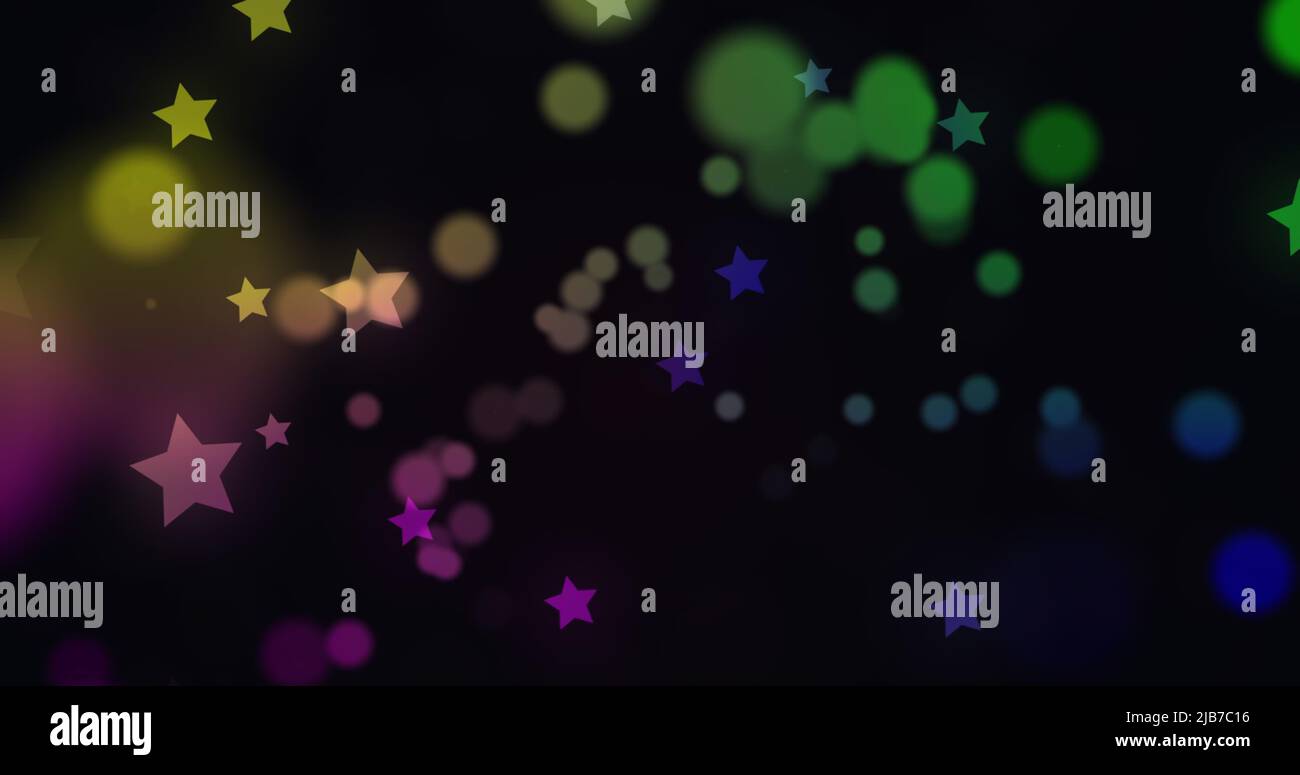 Digitally generated image of multi colored glowing spots and stars