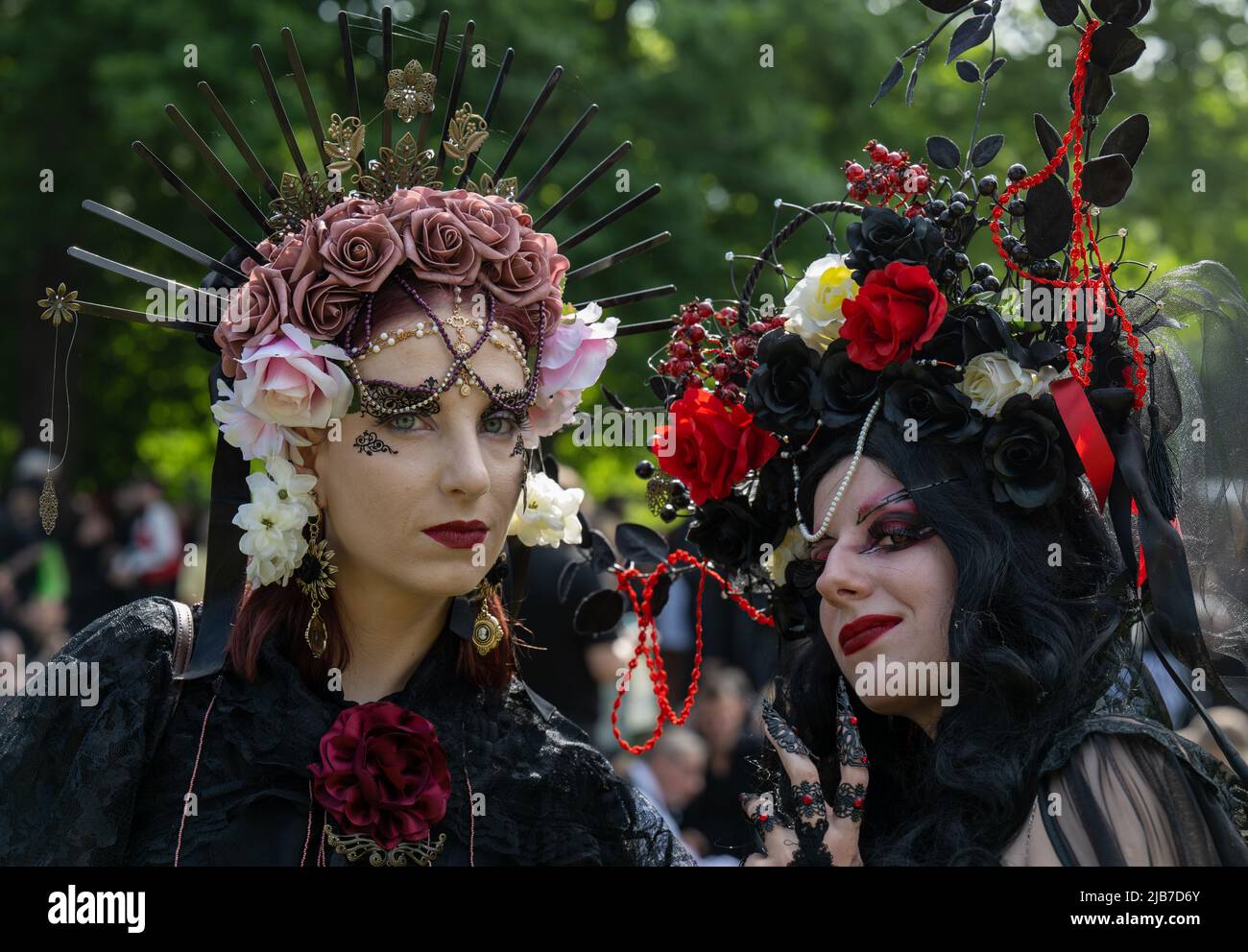 Leipzig, Germany. 03rd June, 2022. Maria (l) from Hamburg and Kalina from Poland arrive at the Clara Zetkin Park in Leipzig to kick off the Wave-Gotik-Treffen (WGT). After a two-year break due to corona, the black scene meets for the 29th edition of the festival. Around 200 bands perform at about 50 venues, tens of thousands of fans of the black scene, costume freaks, dark hippies, vampire fans and rococo lovers transform the city into a very special cosmos. Credit: Hendrik Schmidt/dpa/Alamy Live News Stock Photo