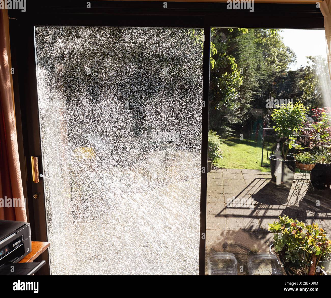 broken crazed toughened glass Stock Photo - Alamy