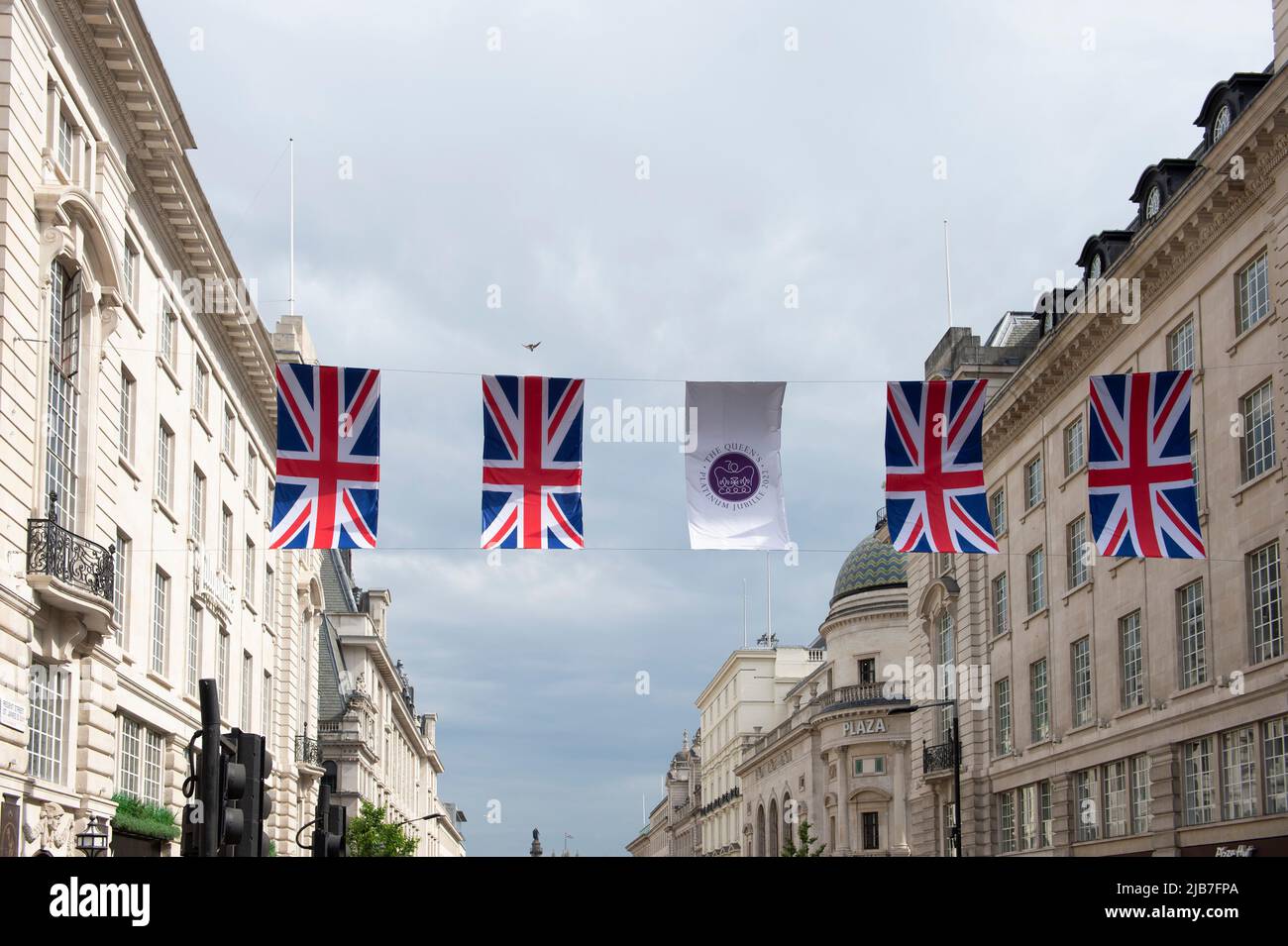 Platinum Jubilee flag with Union Jack flag on Regent Street London Stock Photo