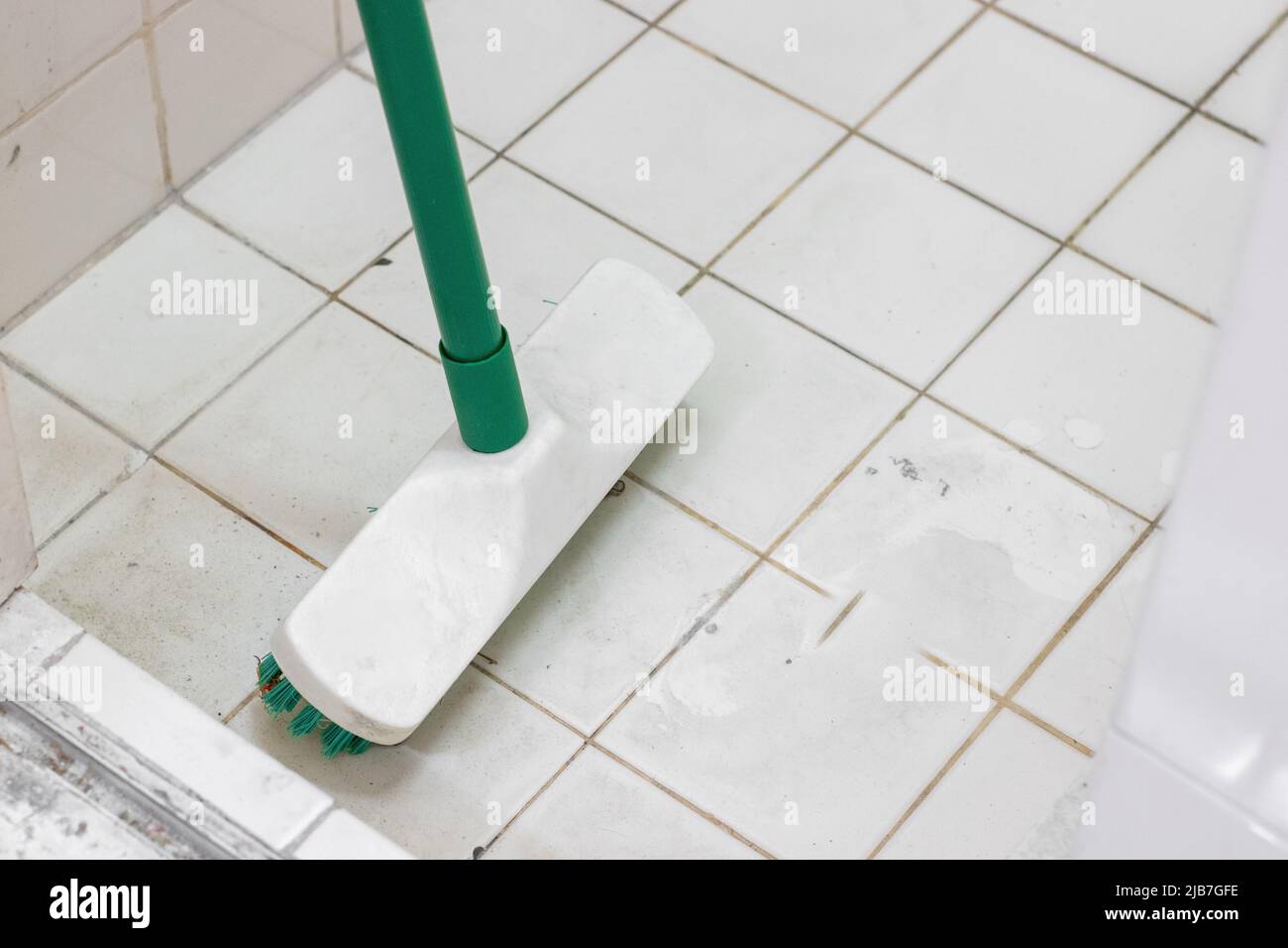 Toilet brush on dirty bathroom floor Stock Photo Alamy