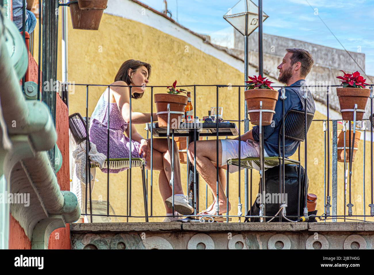 A couple enjoying a nice, romantic lunch in a cafe located on an actual bridge, Guanajuato, Mexico. Stock Photo