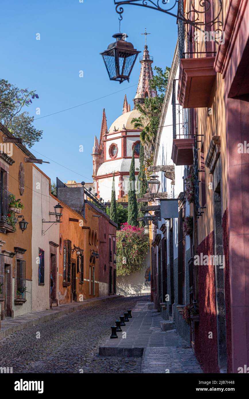 The downtown area of San Miguel de Allende, Mexico. Further up the cobble stone street leads to the city's main plaza. Stock Photo