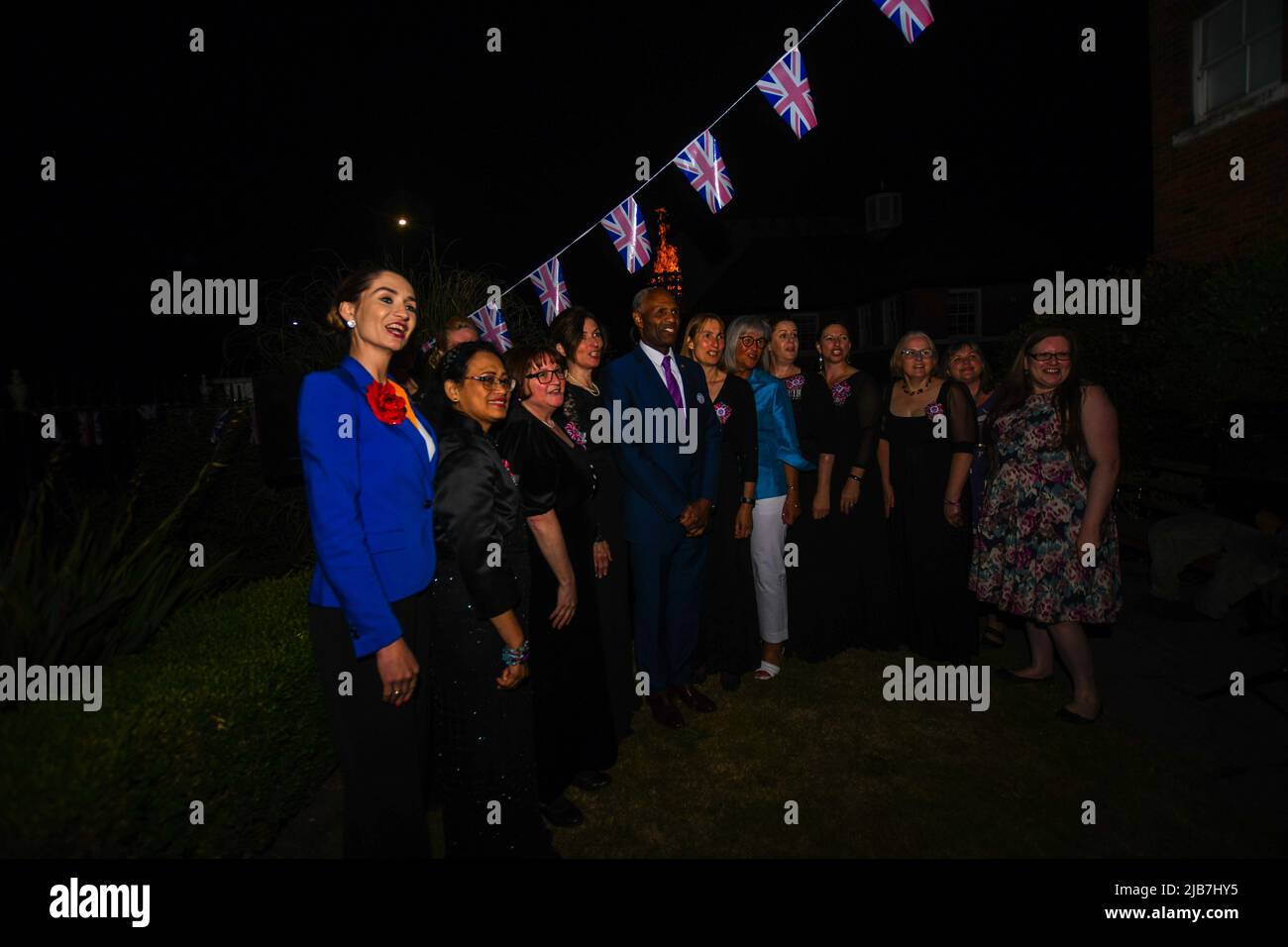 Watford, UK, 2nd Jun 2022, Beacon lighting at Watford Museum with  Deputy Mayor Aga Dychton (left), Luther Blissett OBE (centre) and North London Military Wives Choir plus head of Museum Sarah Priestley (right)  at the lighting of the beacon event for the Platinum Jubilee., Andrew Lalchan Photography/Alamy Live News Stock Photo