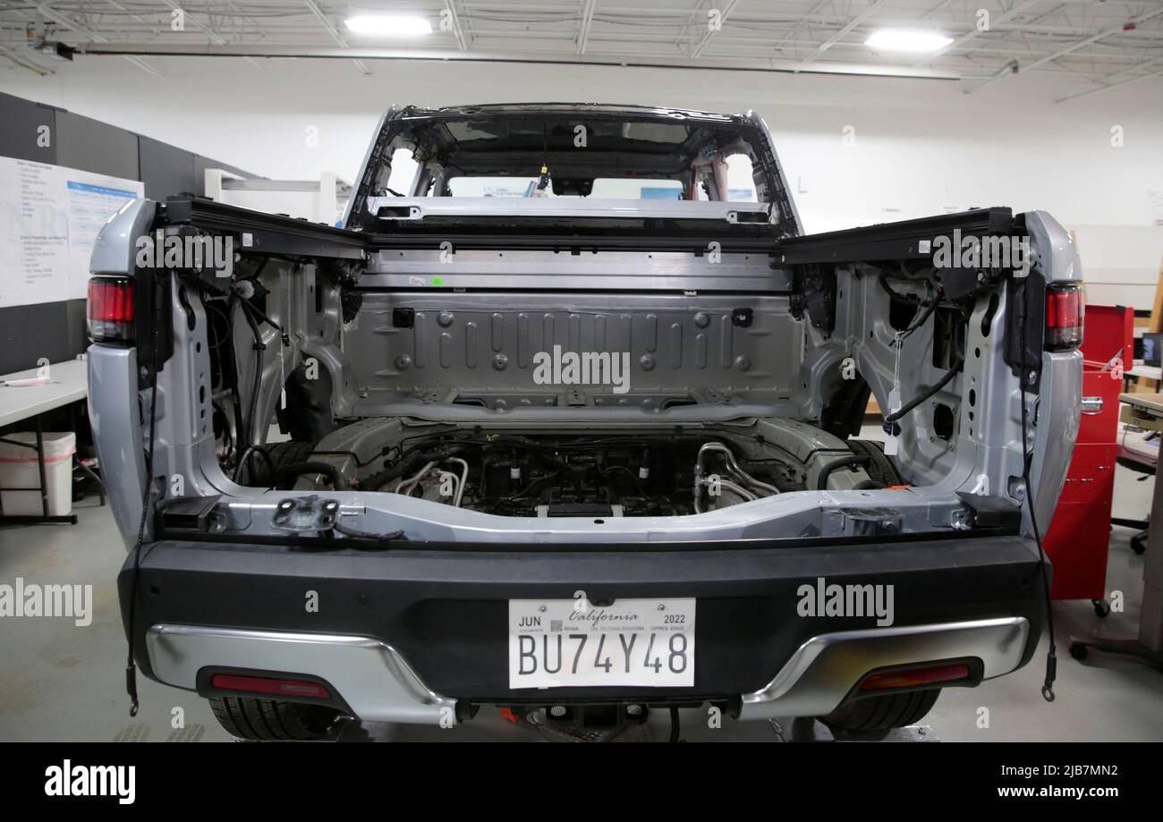 A partially dismantled Rivian R1T electric truck is seen during its teardown at the Munro & Associates headquarters in Auburn Hills, Michigan, U.S., June 3, 2022.  REUTERS/Rebecca Cook Stock Photo