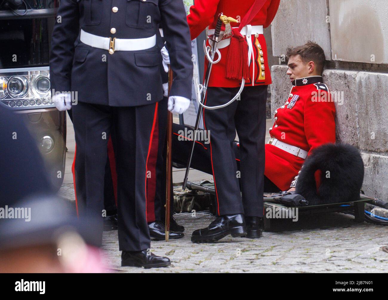 London, UK. 3rd June, 2022. A soldier from The Queen's Guardsmen feels ill at St Pauls Cathedral for a Thanksgiving Service to Her Majesty Queen Elizabeth II to celebrate her 70 years on the throne. Credit: Karl Black/Alamy Live News Stock Photo