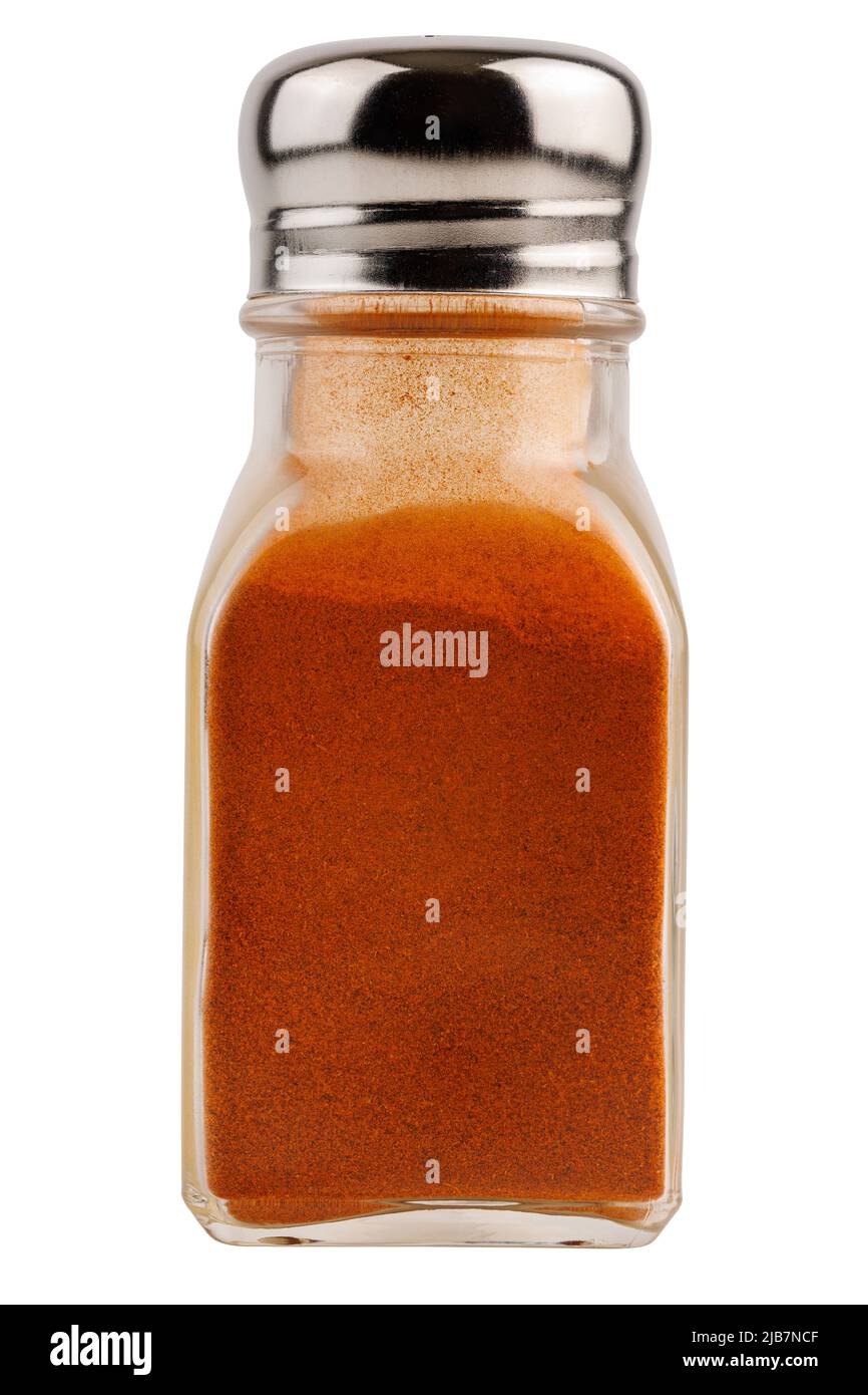 glass pepper pot with ground red paprika pepper isolated on white