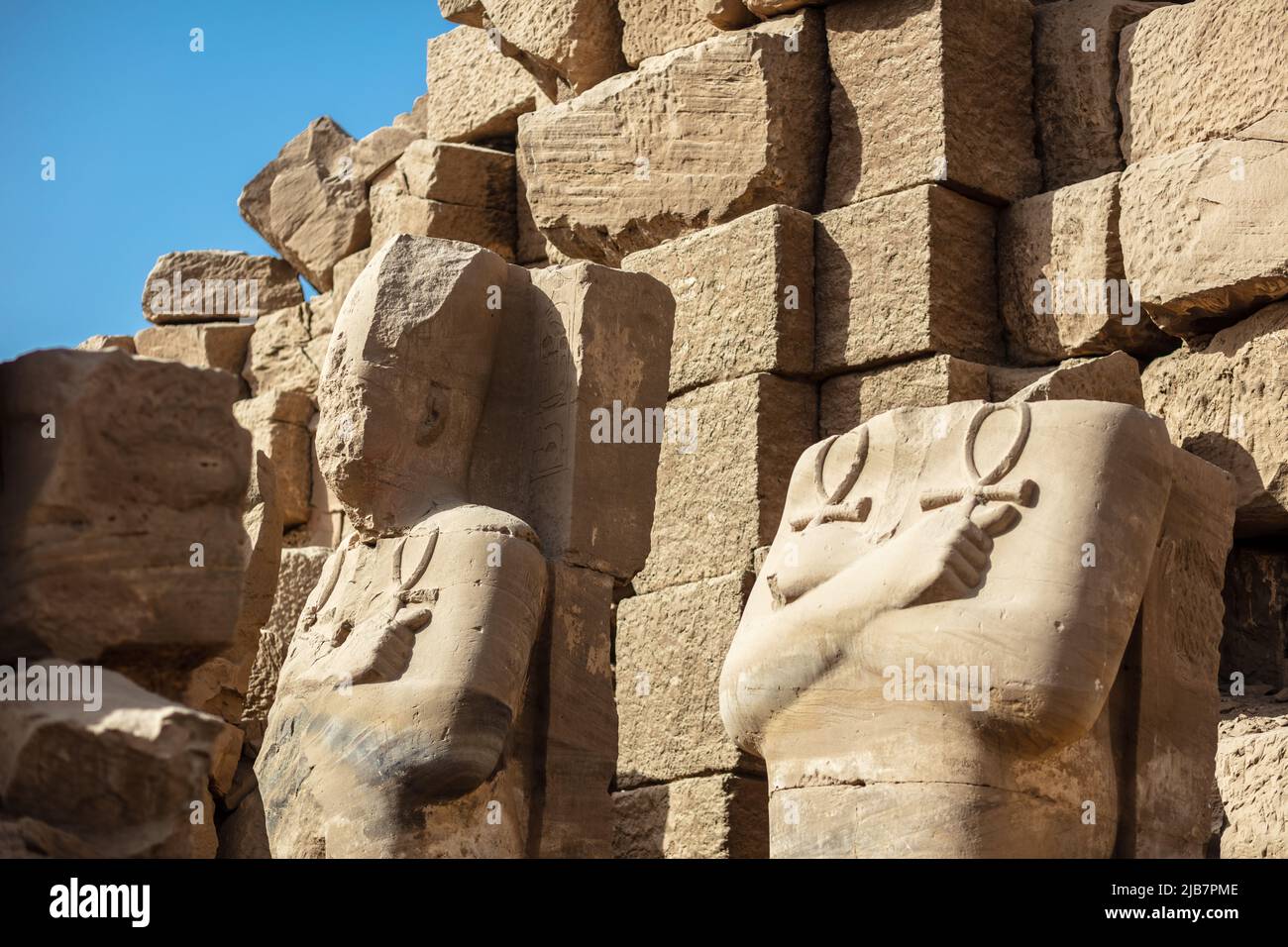 Statues of ancient Egyptian pharaohs and gods. Various hieroglyphs on ...