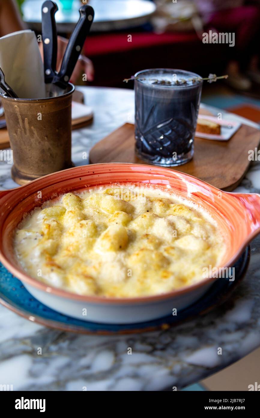Baked gnocchi with parmesan at Cafe Brera, Westferry Circus, Canary Wharf, London, UK Stock Photo
