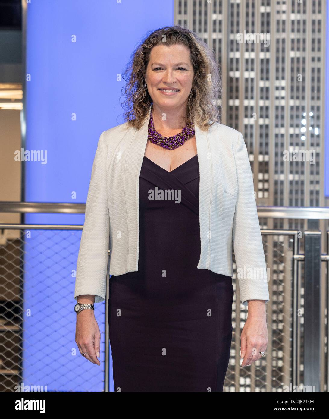 New York, NY - June 3, 2022: Emma Wade-Smith, British Consul General visits the iconic Empire State Building to light building in purple and gold to honor the Platinum Jubilee of Queen Elizebeth II Stock Photo