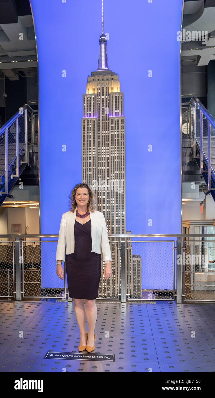 New York, NY - June 3, 2022: Emma Wade-Smith, British Consul General visits the iconic Empire State Building to light building in purple and gold to honor the Platinum Jubilee of Queen Elizebeth II Stock Photo