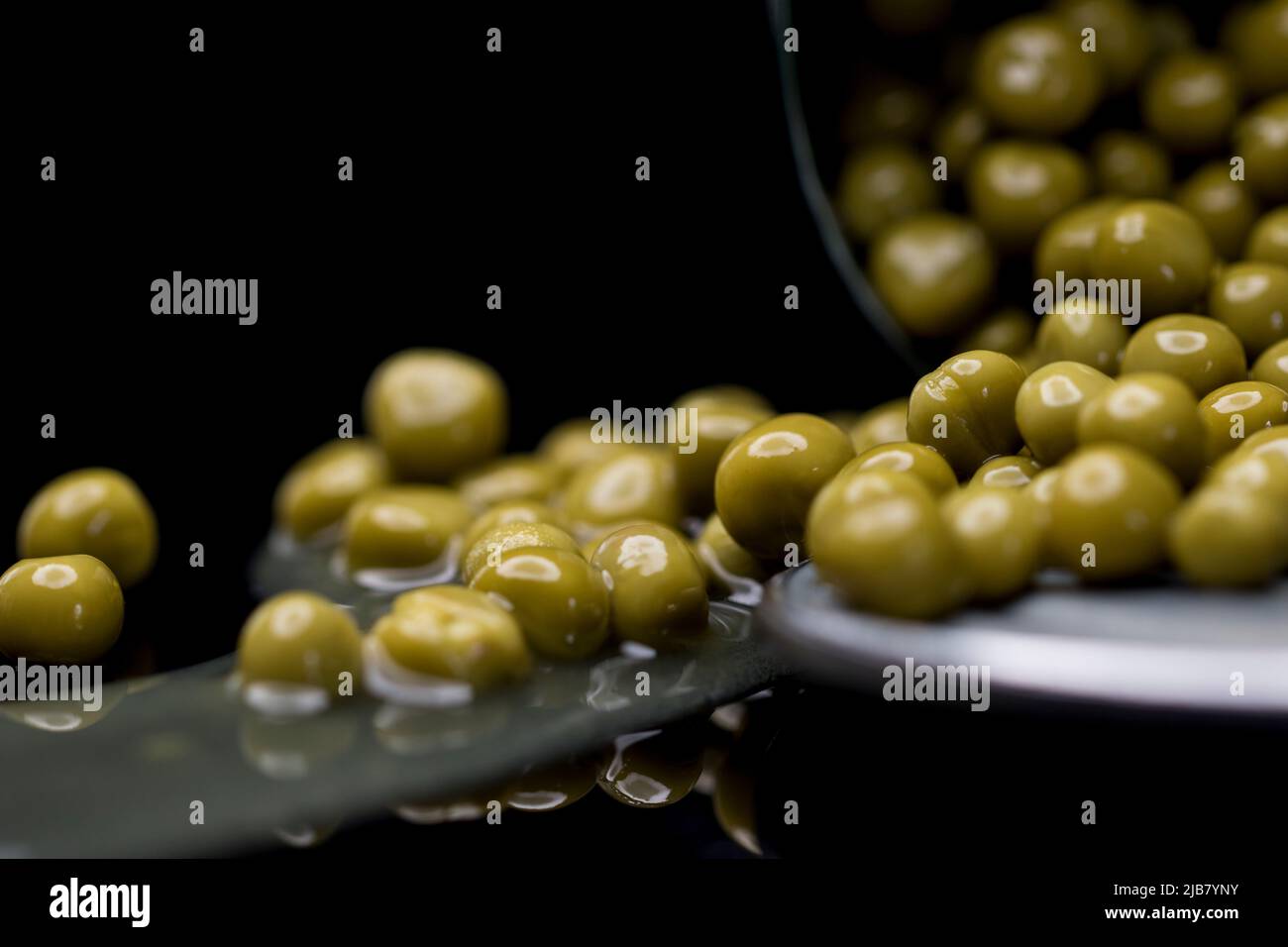 Canned food peas in a tin can. Close up green peas in a can Stock Photo