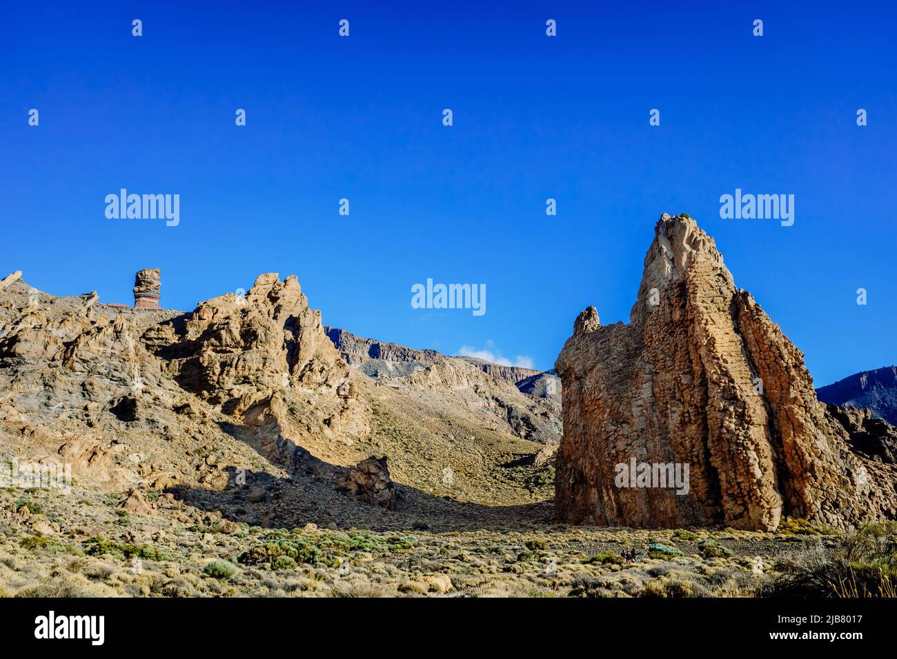 vertical rock stone formations on a bright sky sunny day Stock Photo