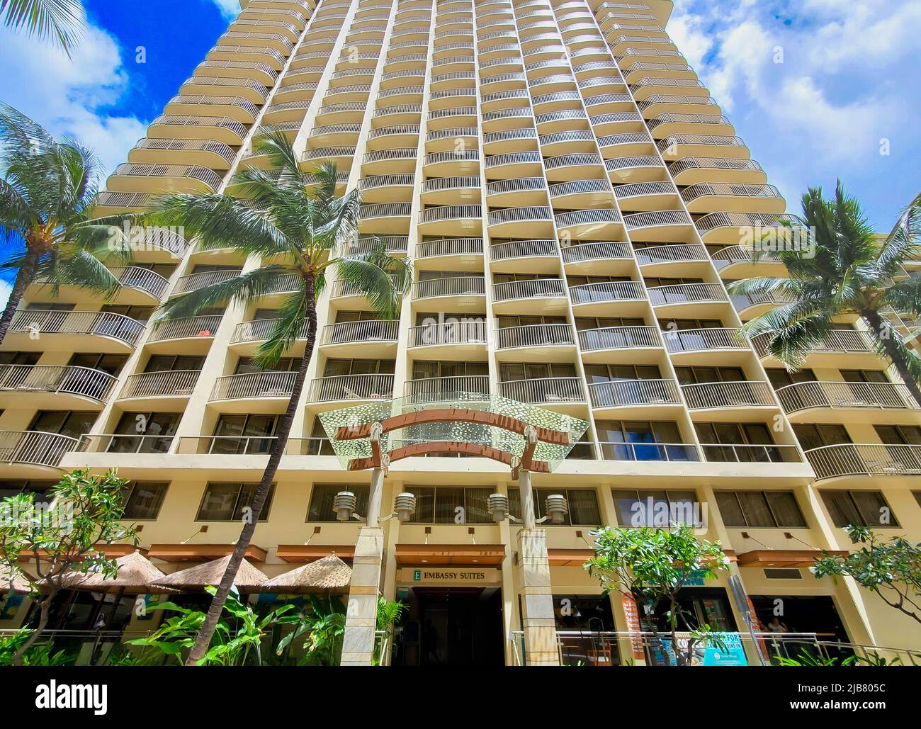 Honolulu, Hawaii USA - May 16, 2021: Photo of the hotel front exterior of the Embassy Suites by Hilton Waikiki Beach Walk. Stock Photo
