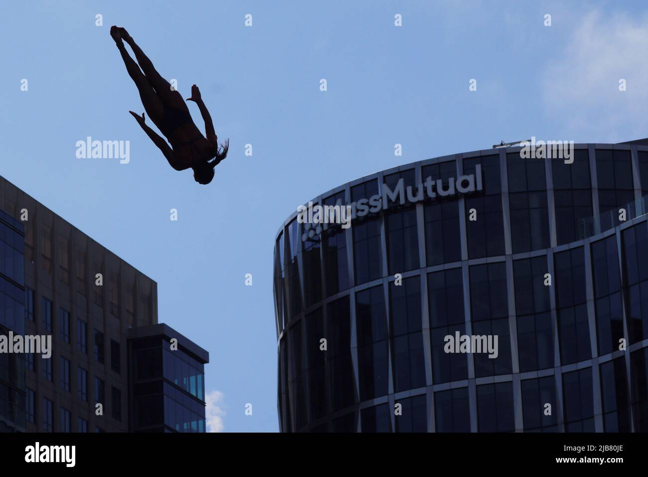 Maria Paula Quintero of Colombia dives off the roof of the Institute of Contemporary Art while competing at the Red Bull Cliff Diving World Series in Boston, Massachusetts, U.S., June 3, 2022.   REUTERS/Brian Snyder Stock Photo