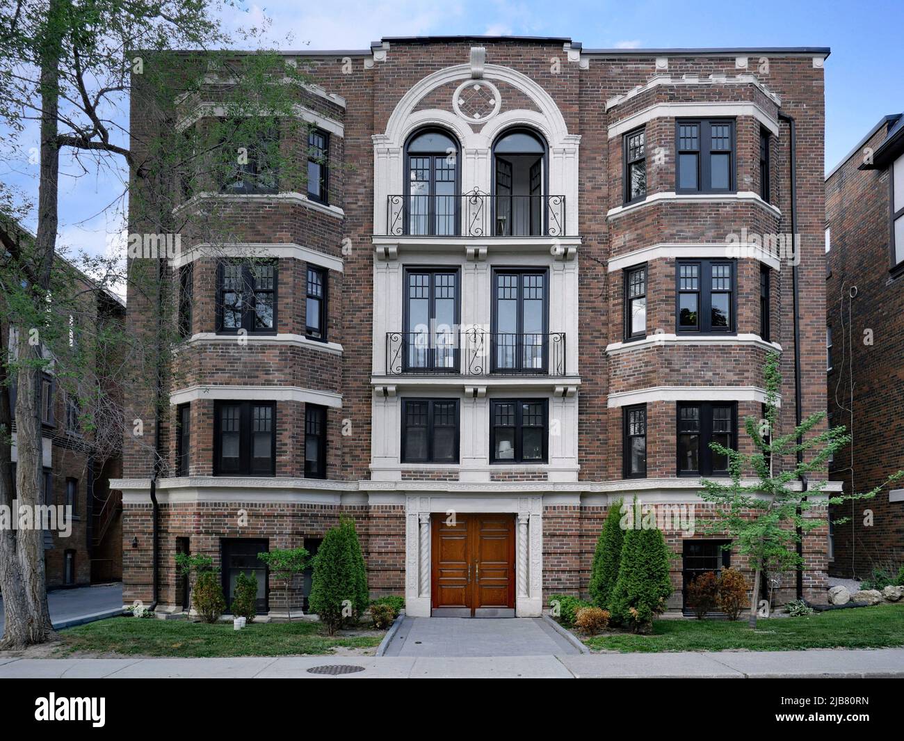 Small old three story brick apartment building Stock Photo