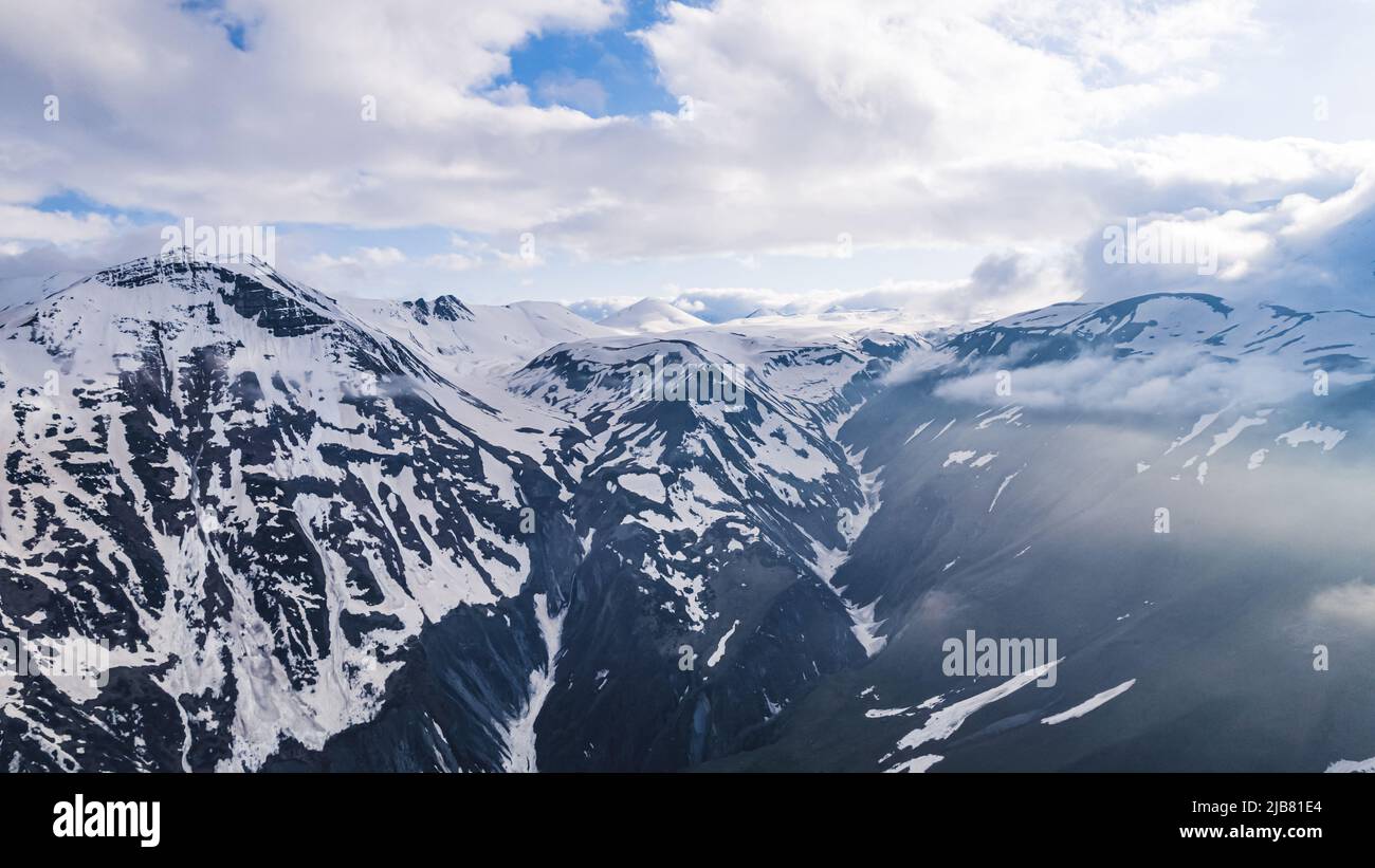 marvelous drone view of snowy mountains. High quality photo Stock Photo