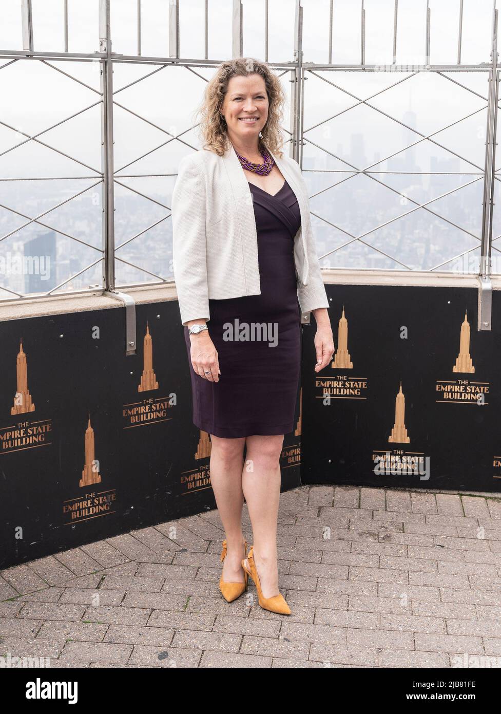 New York, USA. 03rd June, 2022. Emma Wade-Smith, British Consul General visits the iconic Empire State Building to light building in purple and gold to honor the Platinum Jubilee of Queen Elizebeth II (Photo by Lev Radin/Pacific Press) Credit: Pacific Press Media Production Corp./Alamy Live News Stock Photo