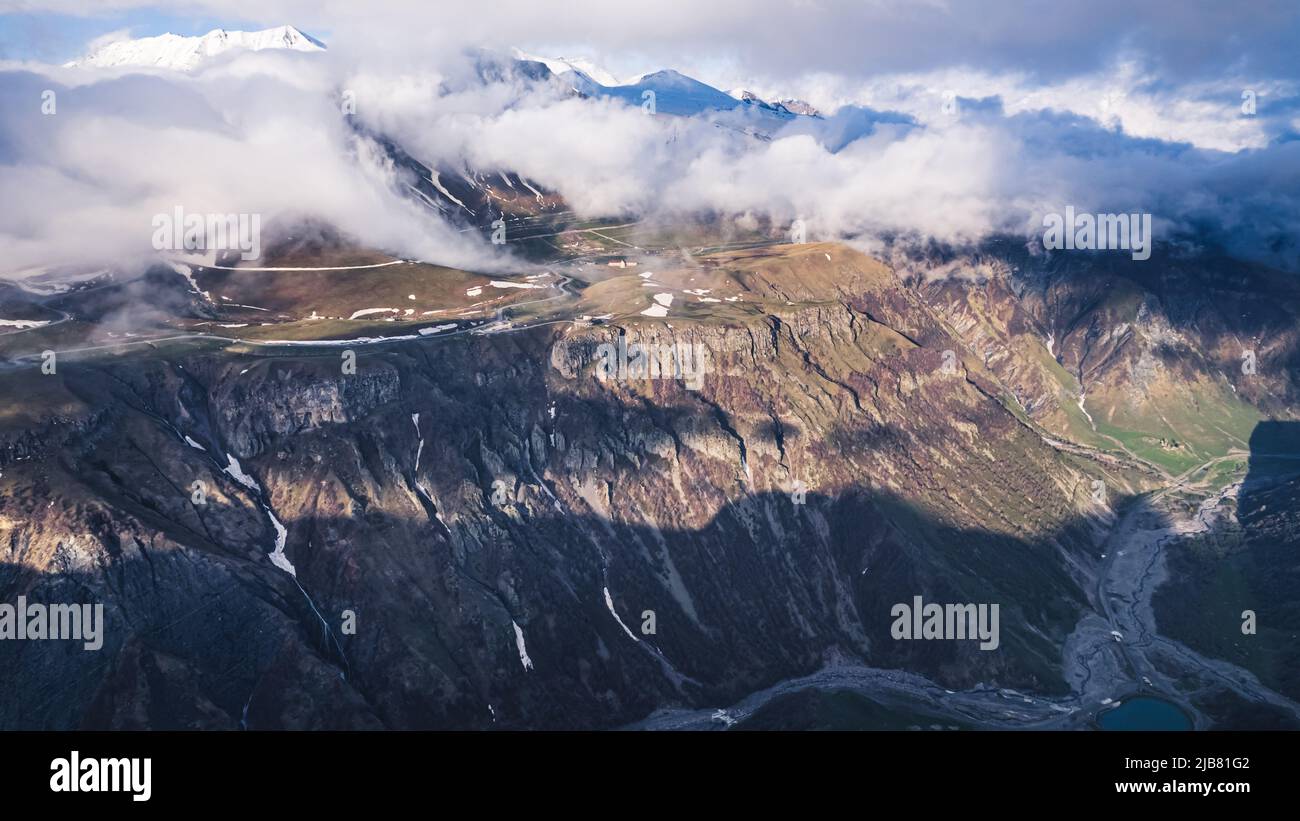 beautiful ascending view of mountains covered by the clouds. High quality photo Stock Photo