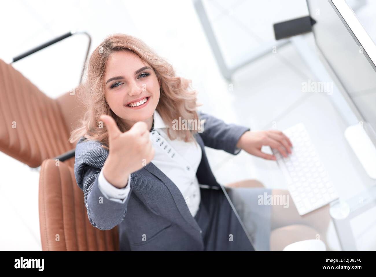 business woman showing thumb up Stock Photo - Alamy