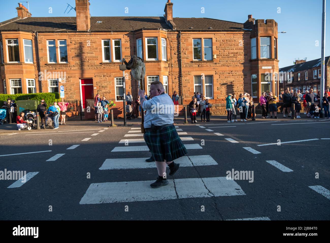 Glasgow , Scotland, UK. 3rd June, 2022. The annual Govan Fair makes a return after a two year absence due to the Covid-19 pandemic. This is an historic event that dates back to 1757 and takes place on the first friday in June. It is a celebration of Govan and its people. The fair queen is crowned and there is a procession through the streets. As part of the tradition a ram's head is carried at the front of the procession. This year Olivia McCulloch from Ibrox Primary School was crowned as the fair's queen. Credit: Skully/Alamy Live News Stock Photo