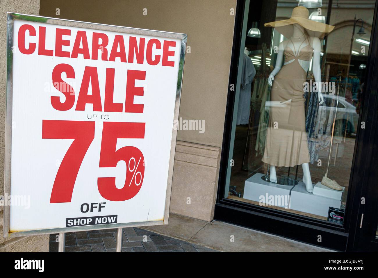 Hallandale Florida Miami,The Village at Gulfstream Park shopping,sign clearance  sale 75% women's clothing dress fashion Stock Photo - Alamy