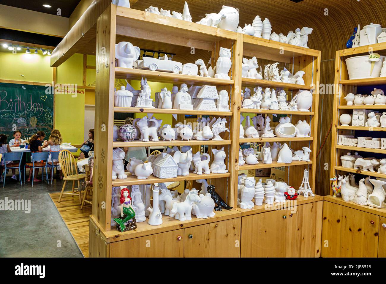 Hallandale Florida Miami,The Village at Gulfstream Park shopping,Color Me Mine Paint-It-Yourself ceramic pottery store,inside interior vases shelves u Stock Photo