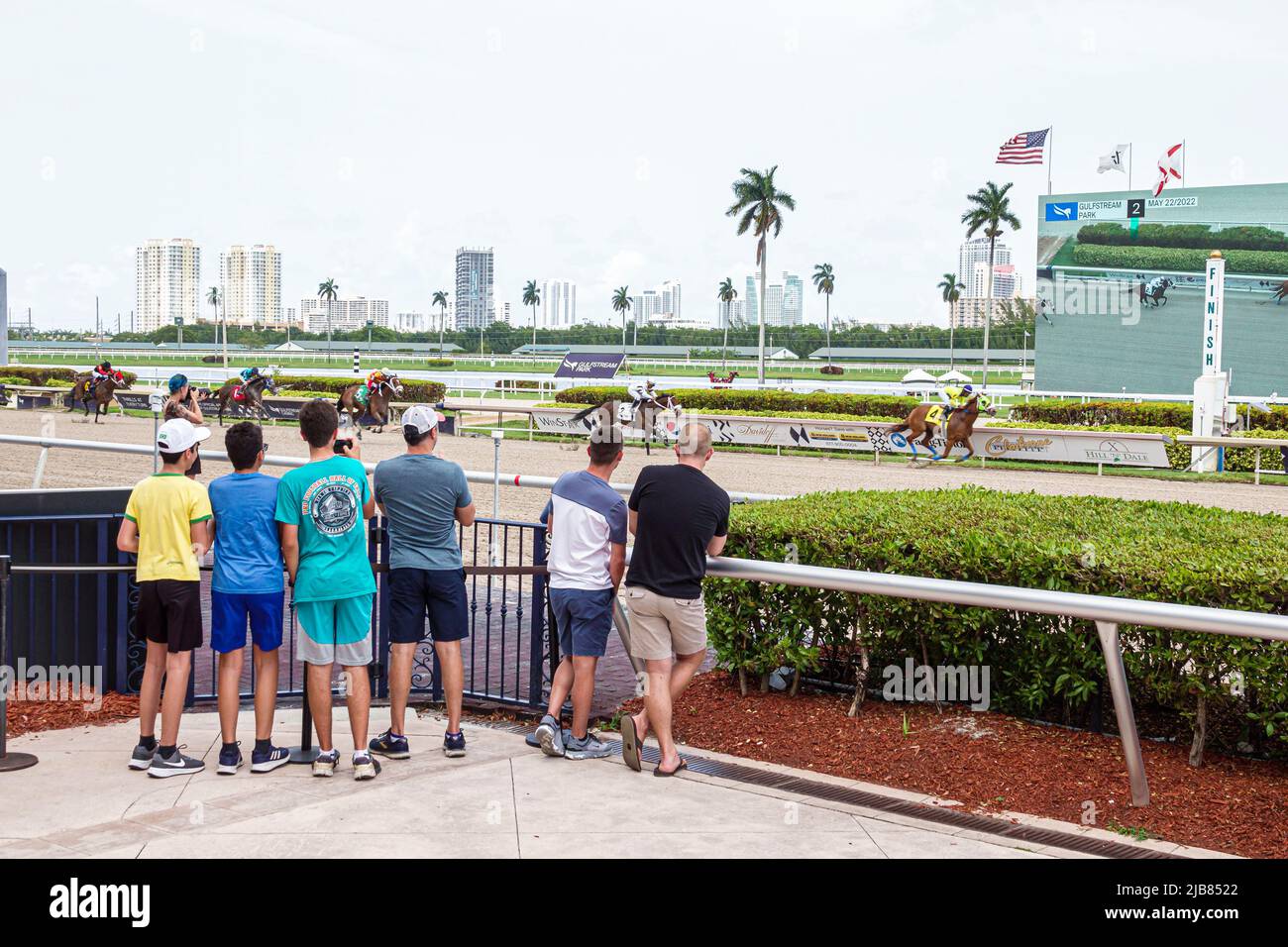 Hallandale Florida Miami,Gulfstream Park racetrack racecourse thoroughbred horse racing track,fans watching race finish line boys men family friends Stock Photo