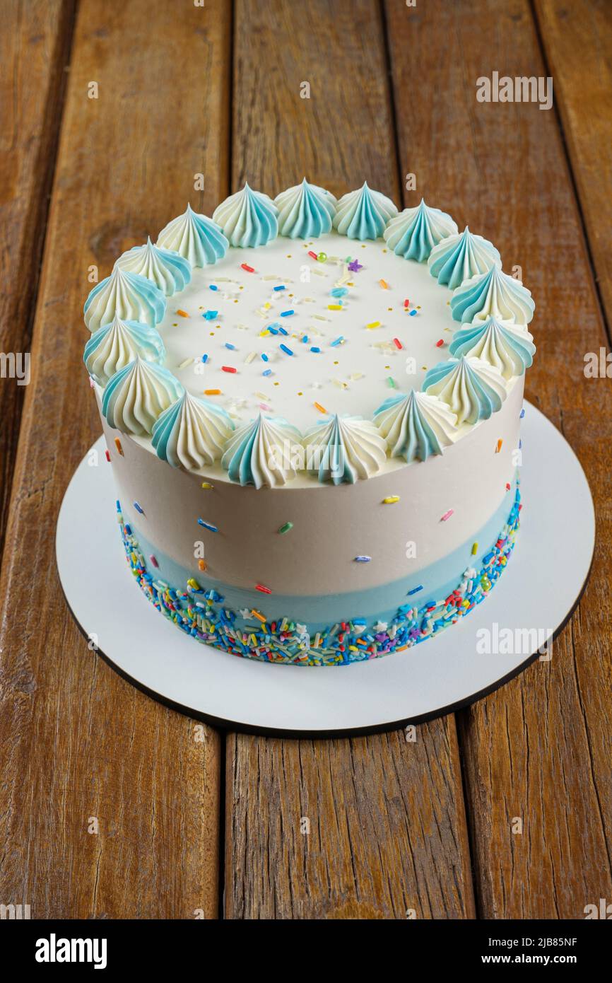 Vanilla cake with butter cream frosting in the shape of zefir vertical. Stock Photo