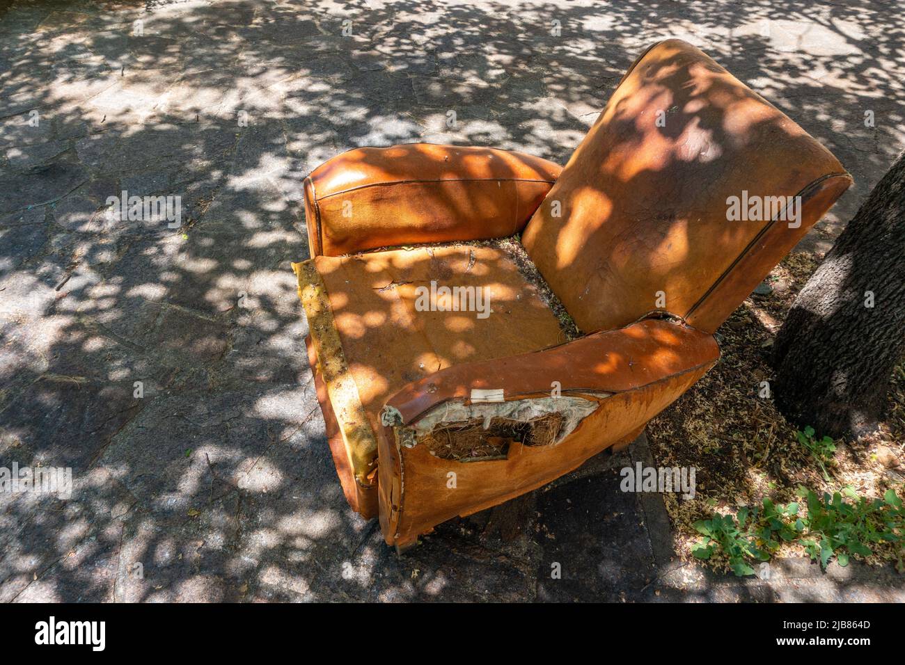 Old leather armchair at Vide Grenier, Car Boot sale in France Stock Photo