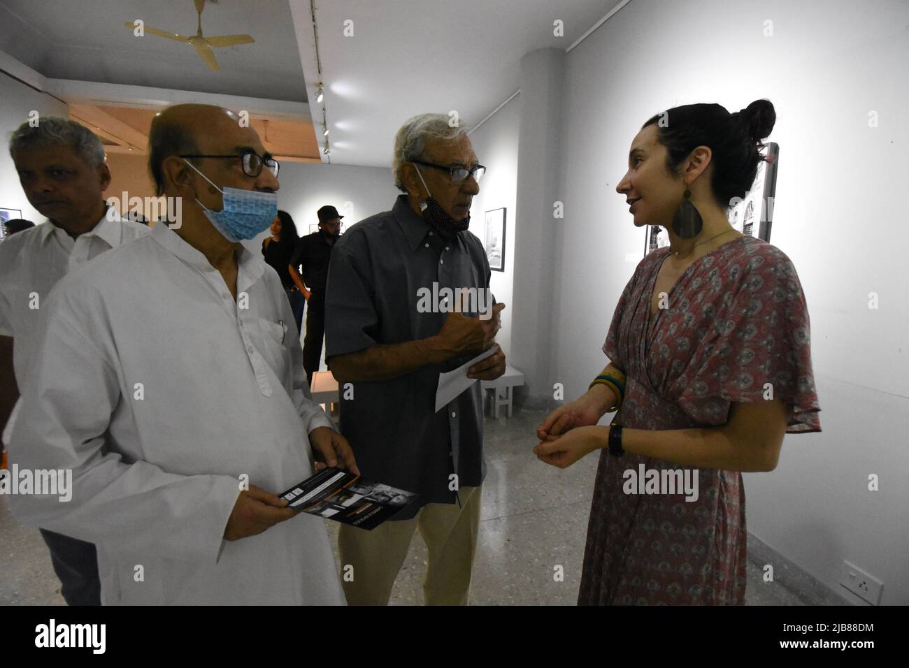 June 3, 2022, Kolkata, West Bengal, India: Prof. Biswatosh Sengupta (L), Eminent Educationist, Photo-Artist, Dr. Abhoy Nath Ganguly (M) Eminent Photo-Artist, and Nola Minolfi (R), Eminent Artist and Photographer, discussing about the exhibition of the Italian photographer Gabriele Basilico (1944 ''“ 2013), that consists of 21 monochrome and color documentations based of transformation of the world's urban contemporary landscapes, the shape and identity of cities and metropolises. This exhibition is showing from 3rd to 19th June, 2022 in Kolkata and is is the 2nd time in India. (Credit Image: © Stock Photo