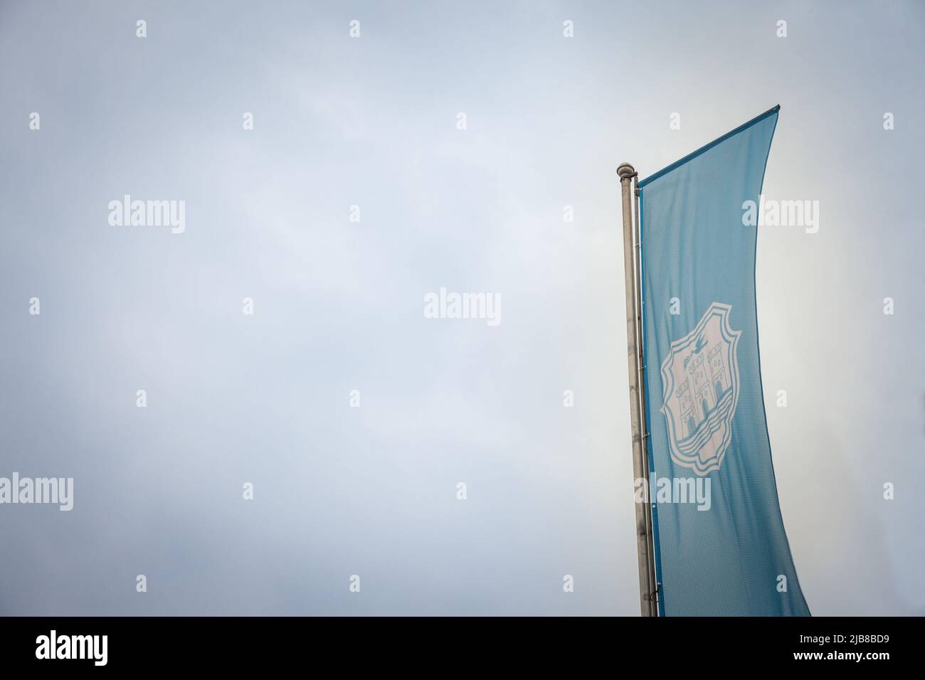 Novi Sad city flag with the coat of arms of the city. It is the official visual and symbol of Novi Sad, the main city of Vojvodina, in Serbia. Stock Photo