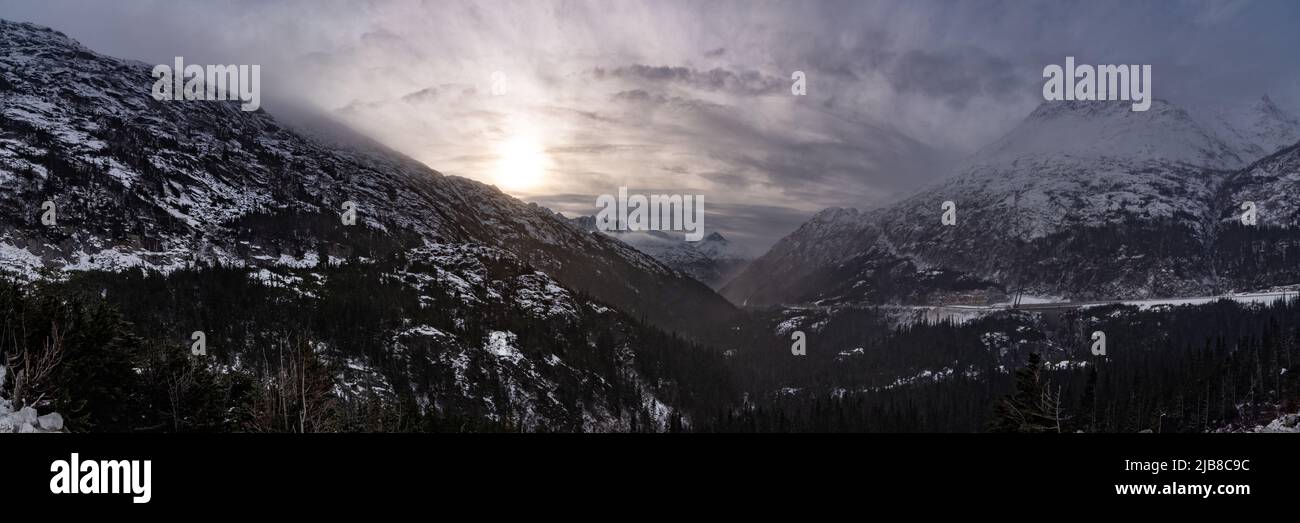 Snowy, moody afternoon views from aerial mountain top view at the beginning of winter in northern Canada. Stock Photo