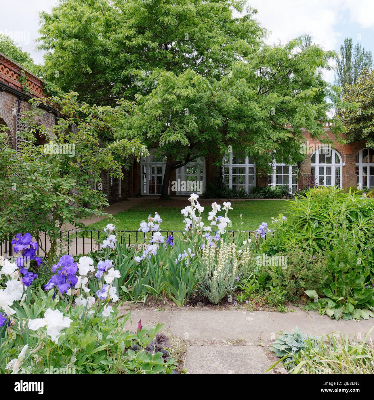 London, Greater London, England, May 28 2022: Lawned garden and Orangery at Holland Park in the Kensington area. Stock Photo