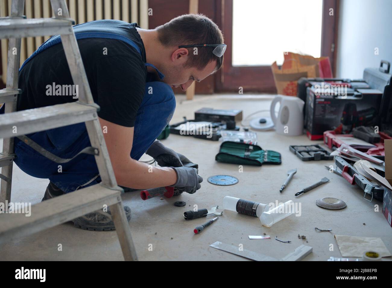 Handyman preparing tools for home improvement Stock Photo