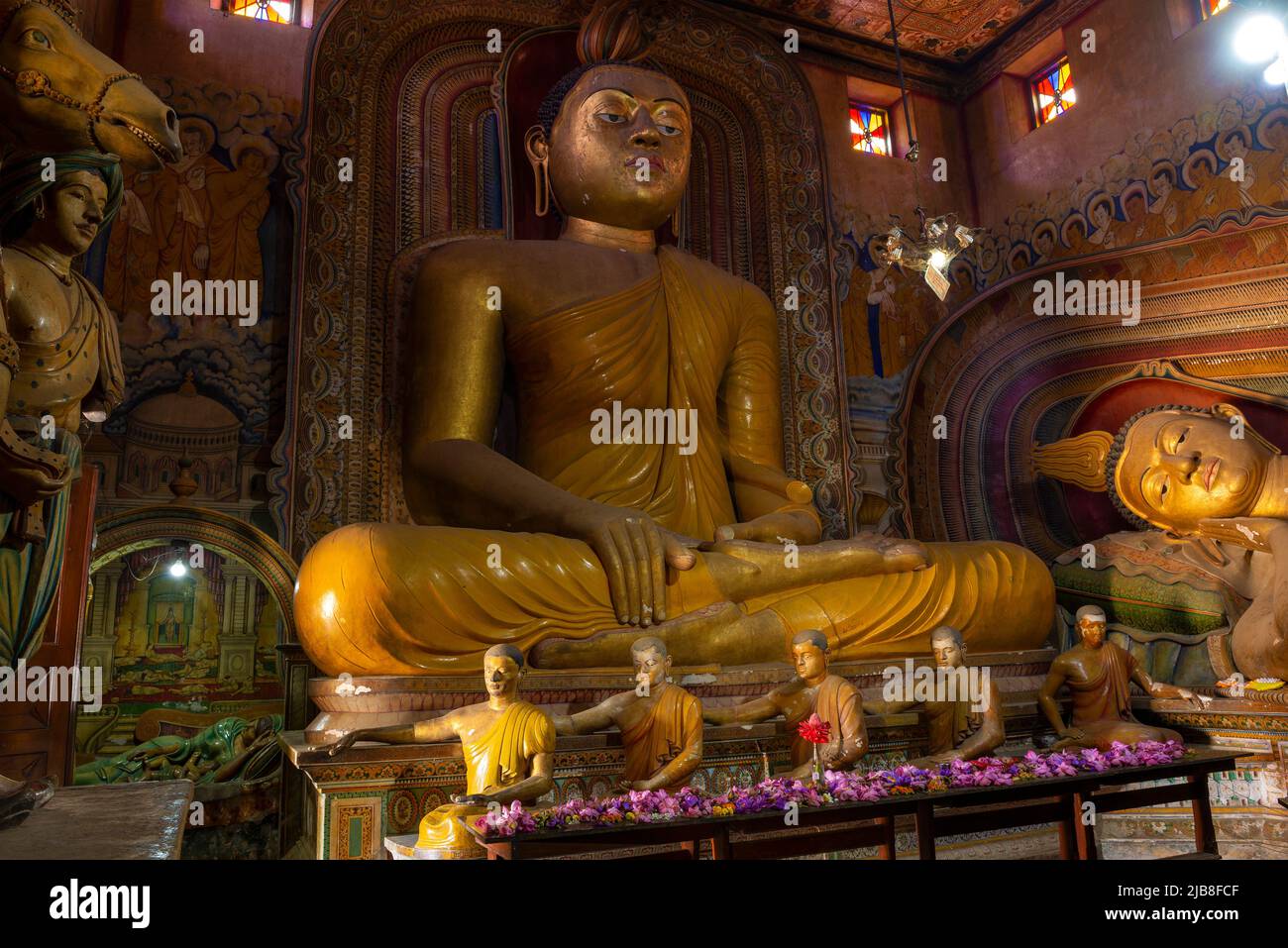 DICKWELLA, SRI LANKA - FEBRUARY 17, 2020: Ancient sculpture of a seated Buddha in the Wewrukannala Buduraja Maha Viharaya Buddhist Temple Stock Photo