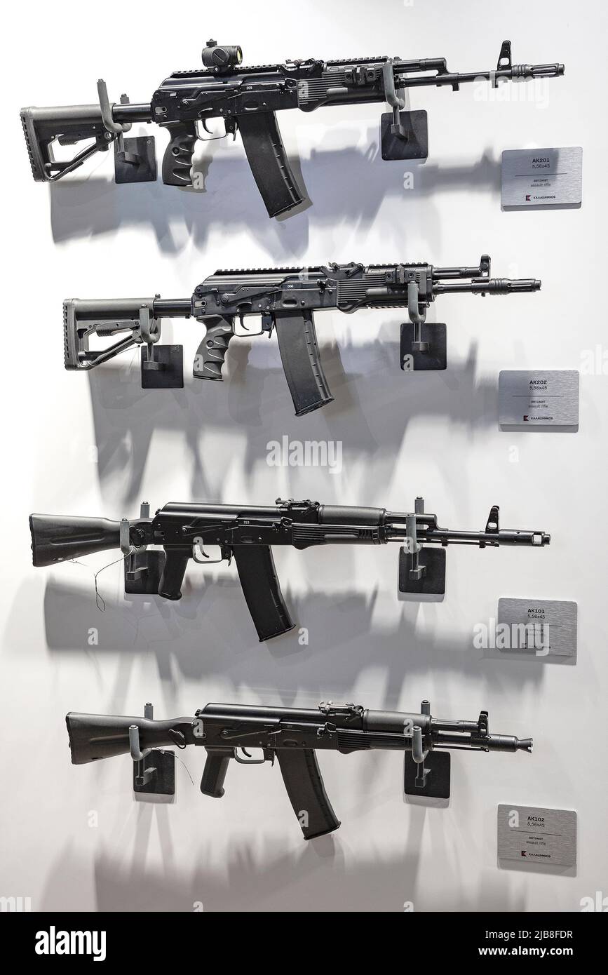 MOSCOW REGION, RUSSIA - AUGUST 25, 2020: A stand with various models of a Kalashnikov assault rifle chambered for the cartridge of NATO countries 5.56 Stock Photo