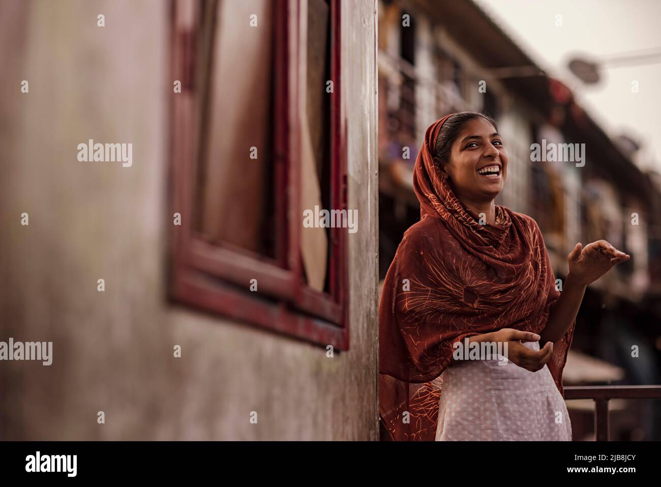 Indian standing in balcony hi-res stock photography and images - Alamy