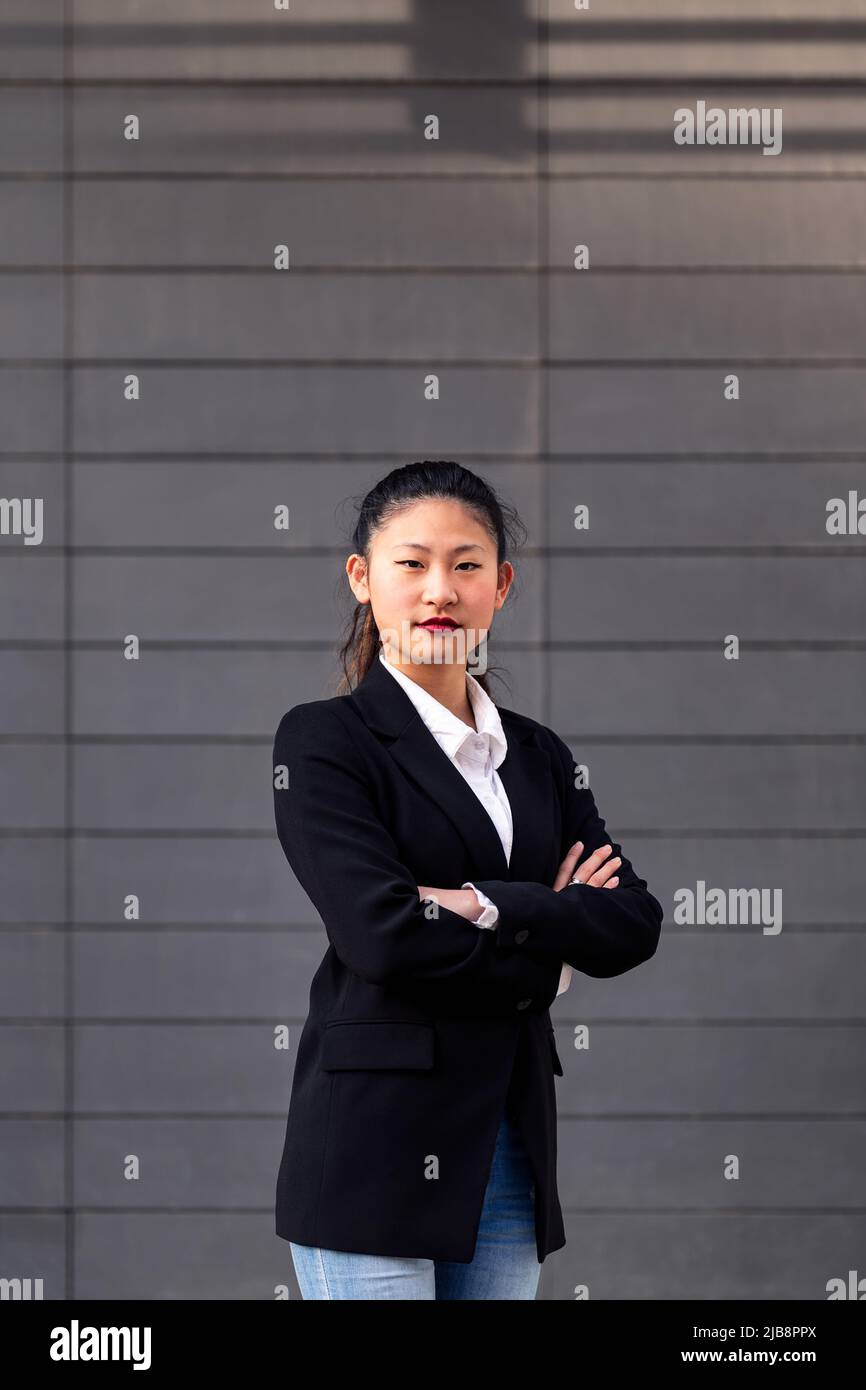 successful woman entrepreneur with arms folded Stock Photo
