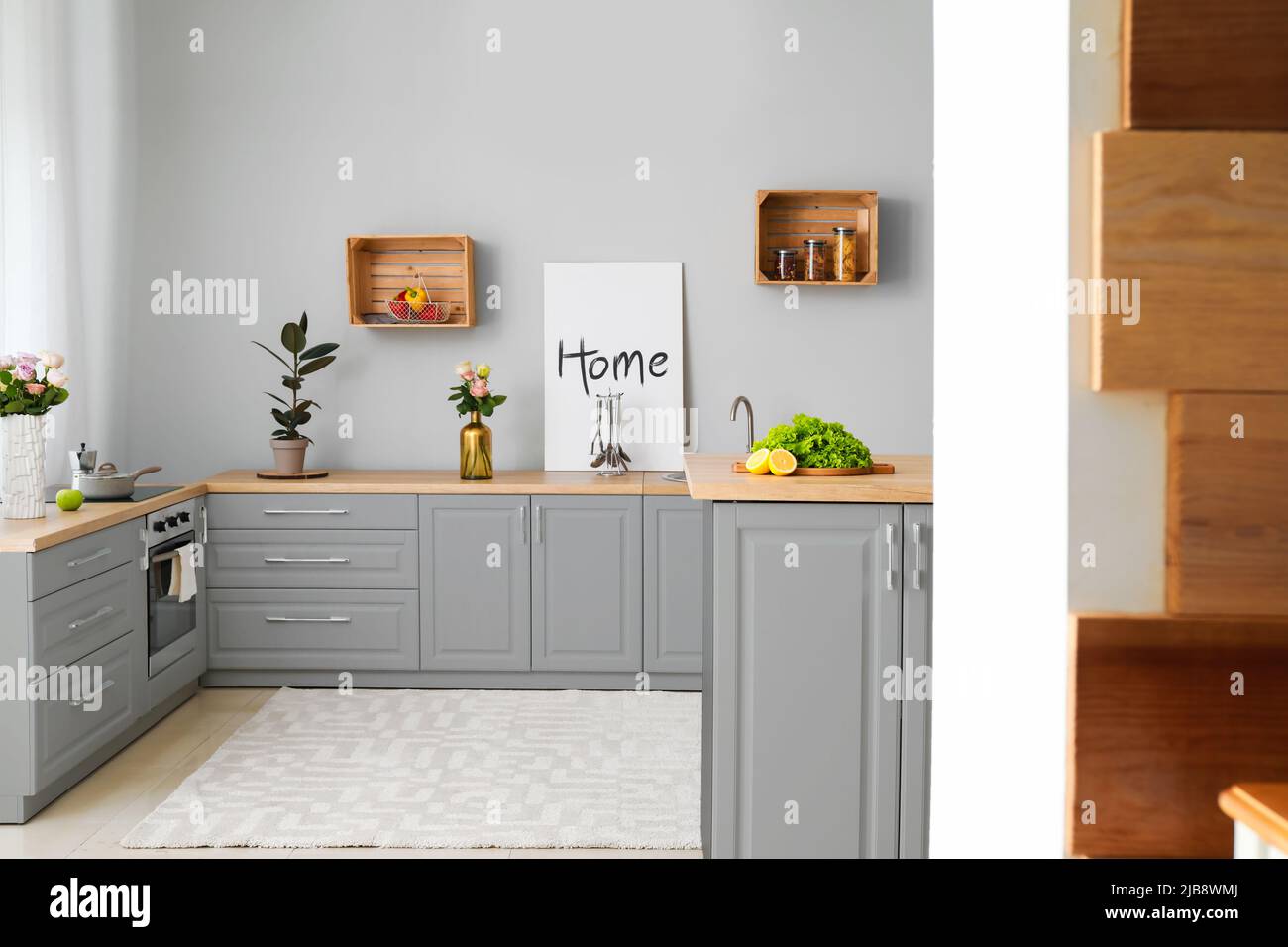 Interior of modern comfortable kitchen with grey furniture Stock Photo ...
