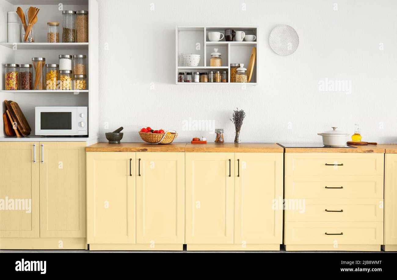 Interior of light modern kitchen with stylish furniture Stock Photo - Alamy