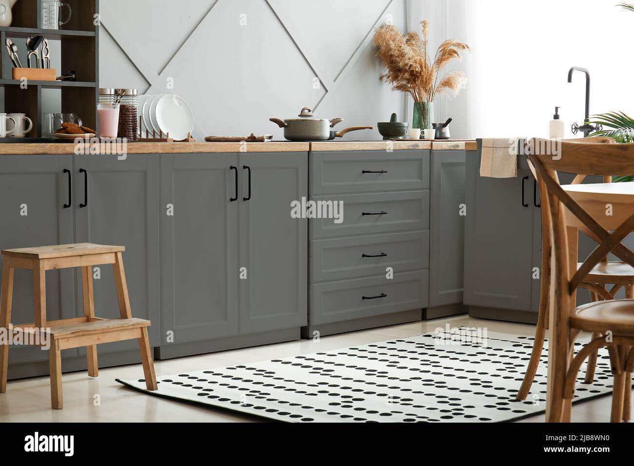 Interior of modern kitchen with grey furniture Stock Photo - Alamy