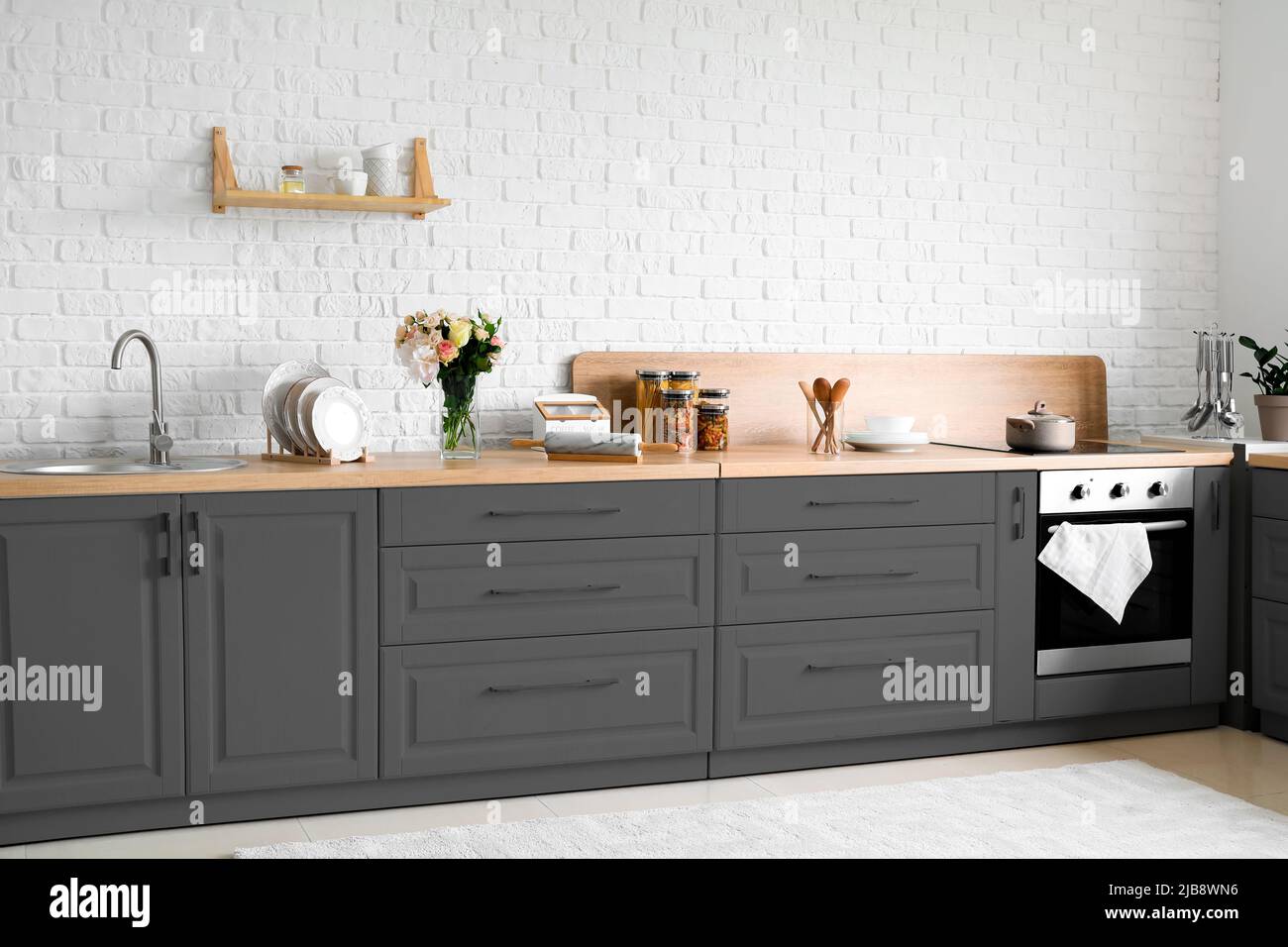 Stylish interior of modern kitchen with modern furniture Stock Photo ...
