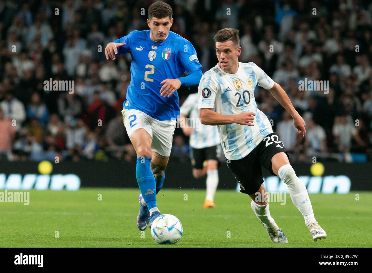 Giovani Lo Celso of Argentina is challenged by Giovanni Di Lorenzo of Italy during the Italy v Argentina - Finalissima 2022 match at Wembley Stadium on June 1, 2022 in London, England.(MB Media) Stock Photo