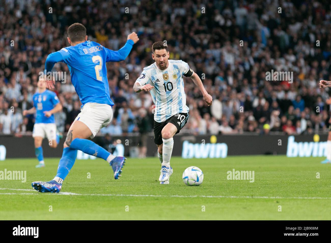 Lionel Messi (c) of Argentina eludes Giovanni Di Lorenzo of Italy during the Italy v Argentina - Finalissima 2022 match at Wembley Stadium on June 1, 2022 in London, England.(MB Media) Stock Photo
